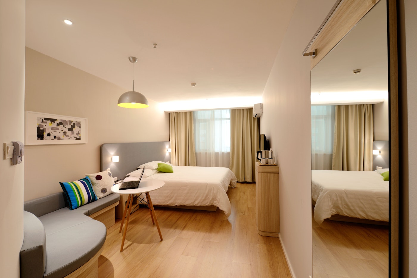 Hostel dormitory with neatly arranged beds