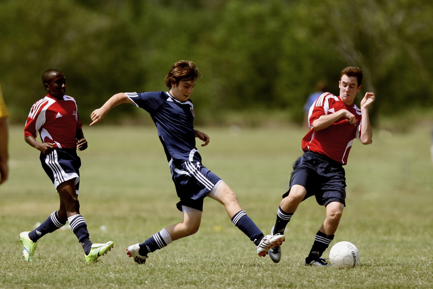 Students playing football on a field